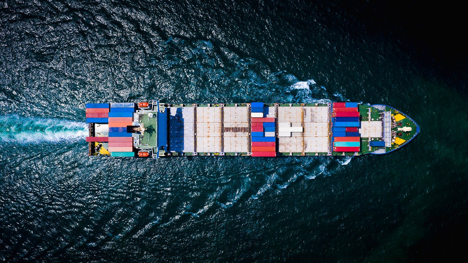 Aerial view of a loaded container ship at sea